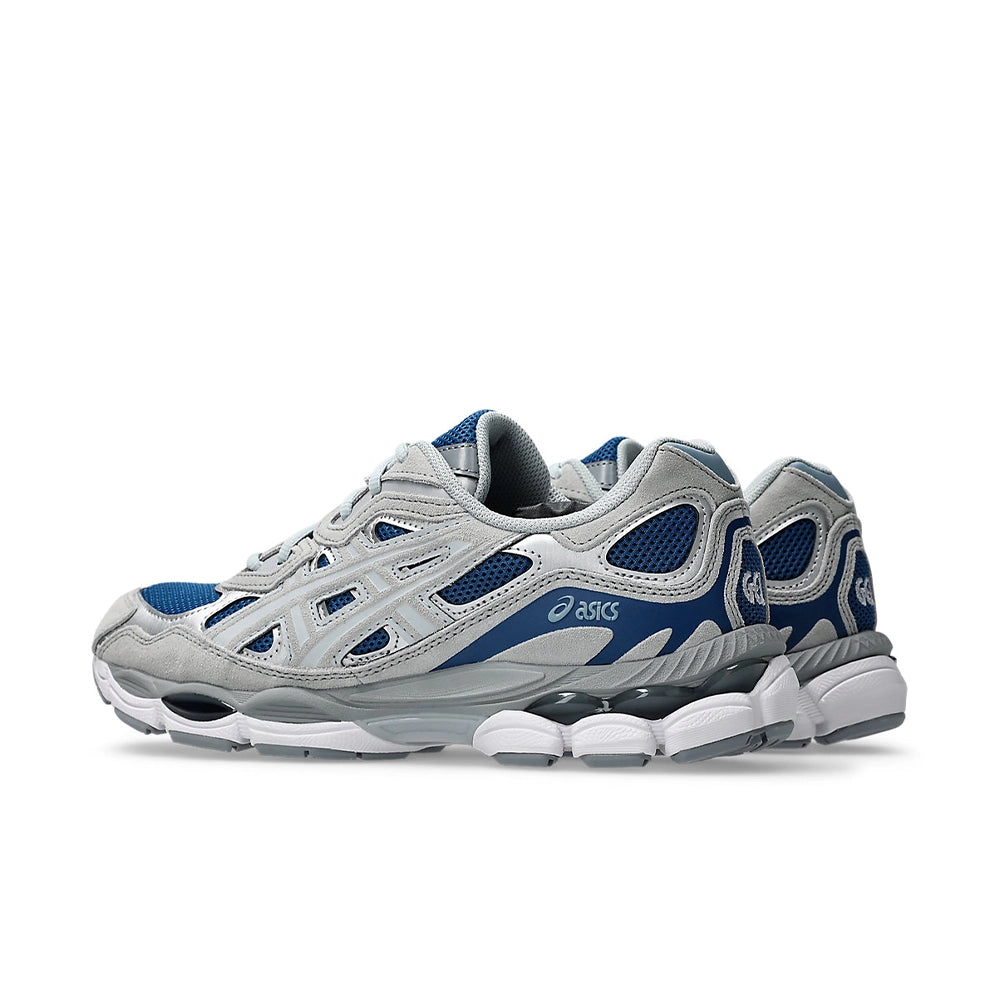 Pair of ASICS GEL-NYC Twilight Blue Gravel sneakers, rear three-quarter view showing blue heel panels and sculpted soles.