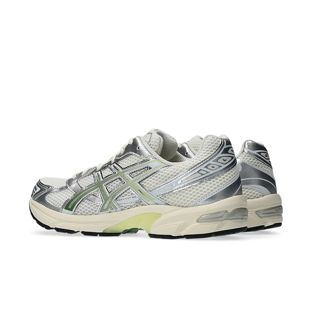 ASICS GEL-1130 Cream Cedar Green pair from a rear three-quarter angle, showing silver overlays and GEL heels.