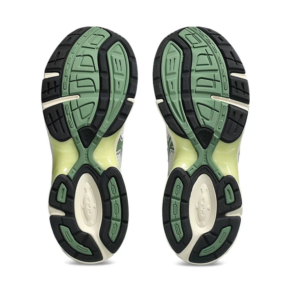 ASICS GEL-1130 Cream Cedar Green outsoles with green and black tread and pale yellow midfoot panels.