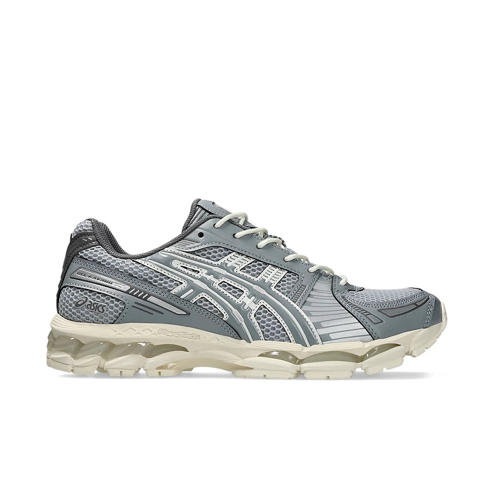 ASICS Gel-Kayano 12.1 in grey with silver stripes and a cream sole, outer side view.