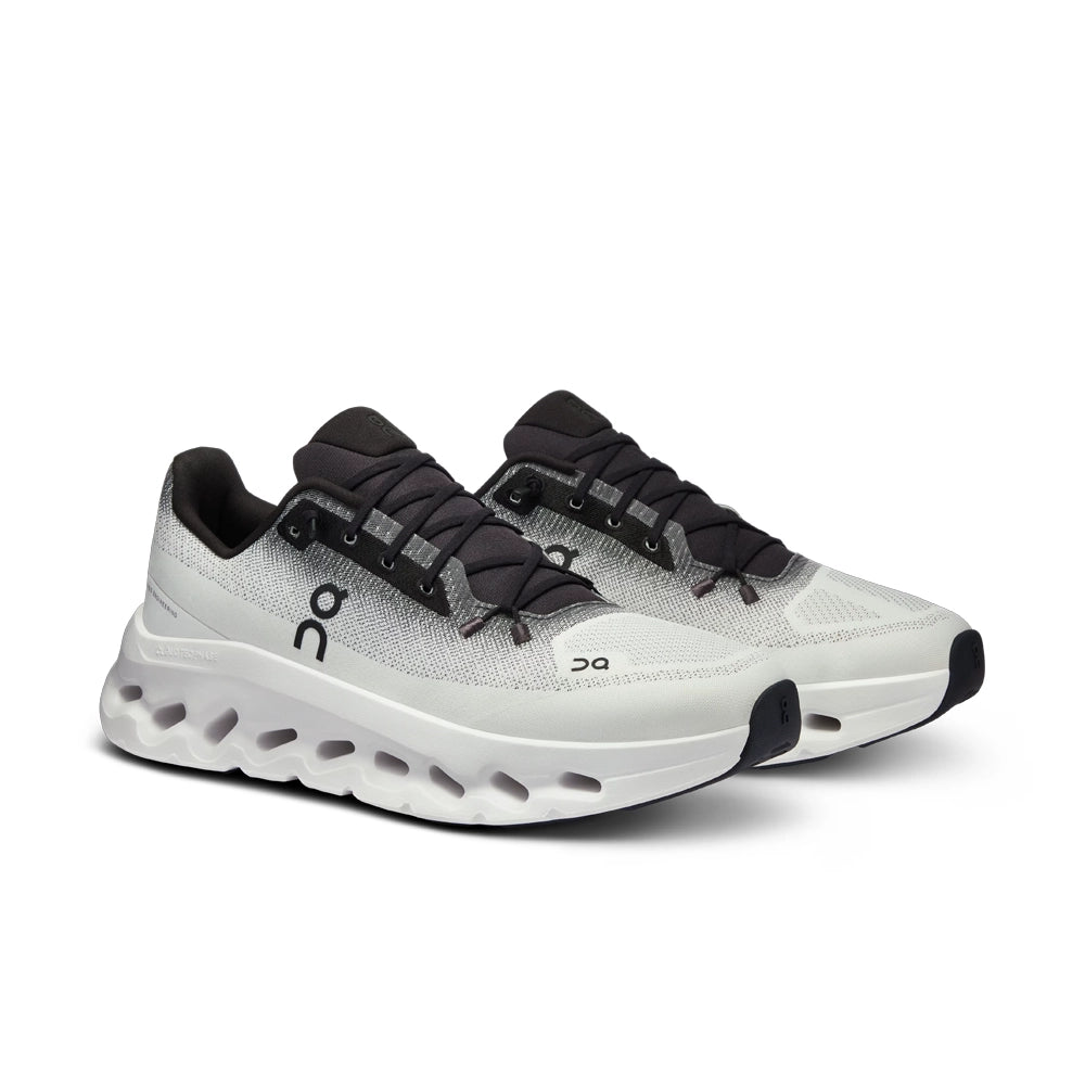 Pair of On Cloudtilt Black Ivory sneakers in three-quarter view, showing black tongues and ivory mesh uppers.
