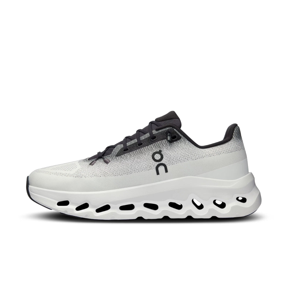 Opposite side view of the On Cloudtilt Black Ivory sneaker, showing the On logo and curved ivory sole.