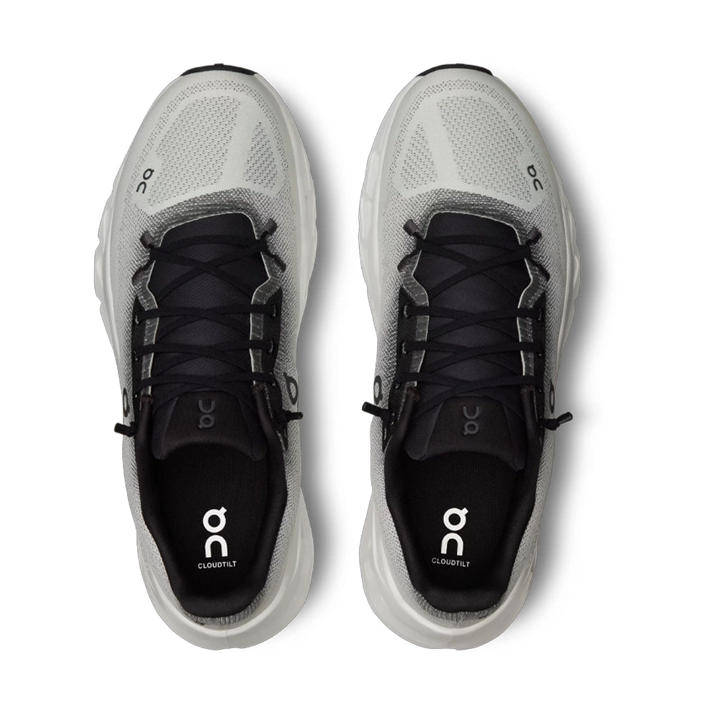 Top view of On Cloudtilt Black Ivory sneakers with black laces, black tongues and branded insoles.