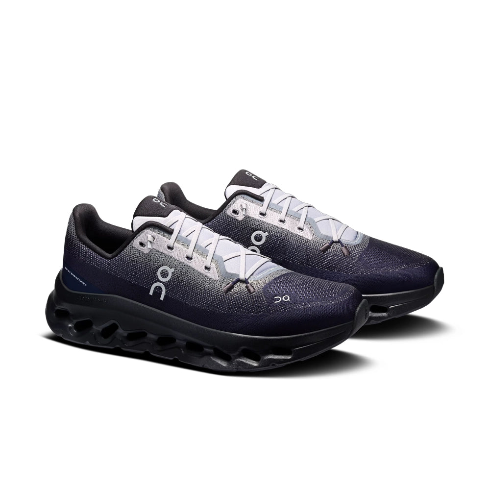 Pair of On Cloudtilt Platinum Midnight sneakers, three-quarter view showing navy and gray uppers and light gray laces.