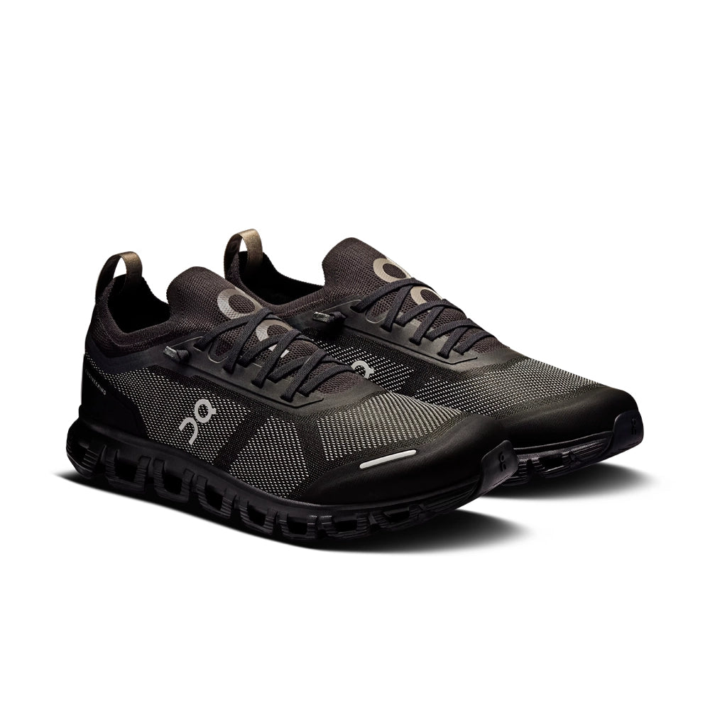 Pair of On Cloud 6 Versa 'Black Eclipse' sneakers angled forward, showing black laces and gray mesh uppers.
