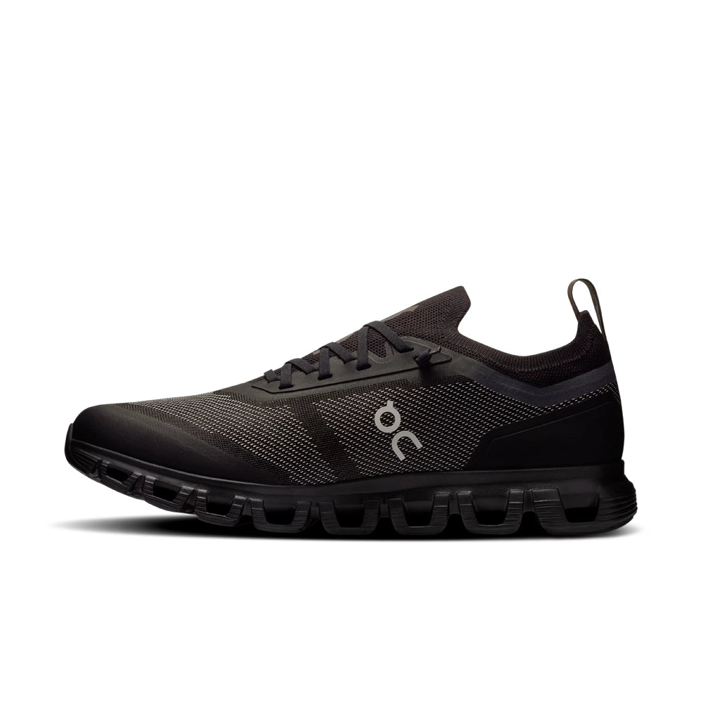 On Cloud 6 Versa 'Black Eclipse' inner side view, showing the On logo, knit collar and black segmented sole.