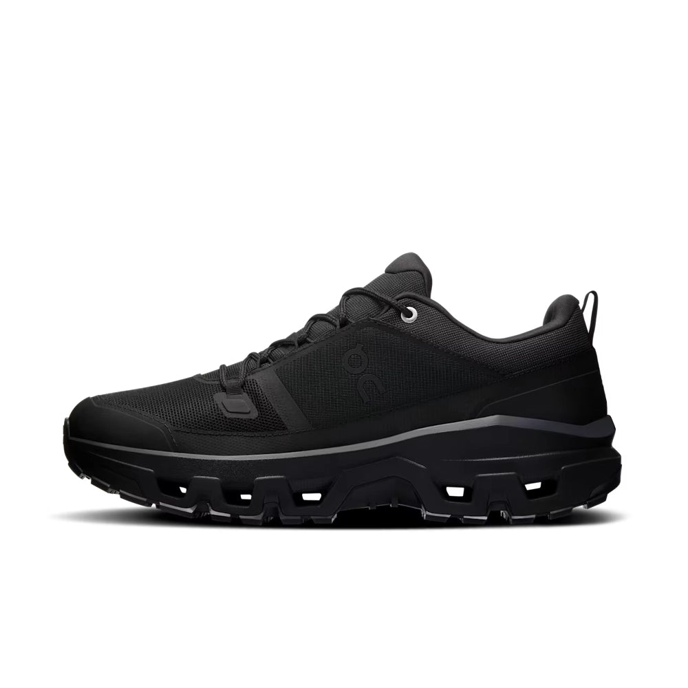On Cloudrock Low Waterproof in black, inner side view showing the low-cut profile and textured sole.