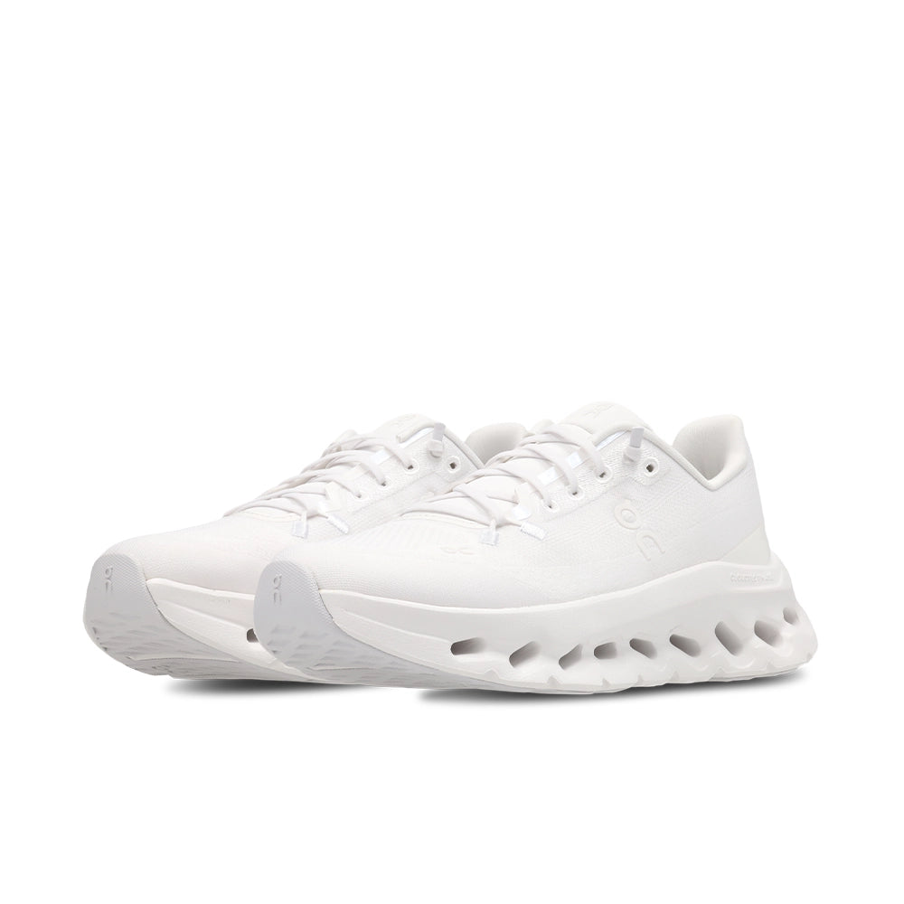Pair of women's On Cloudtilt White Frost sneakers, front three-quarter view showing white laces and rounded toes.