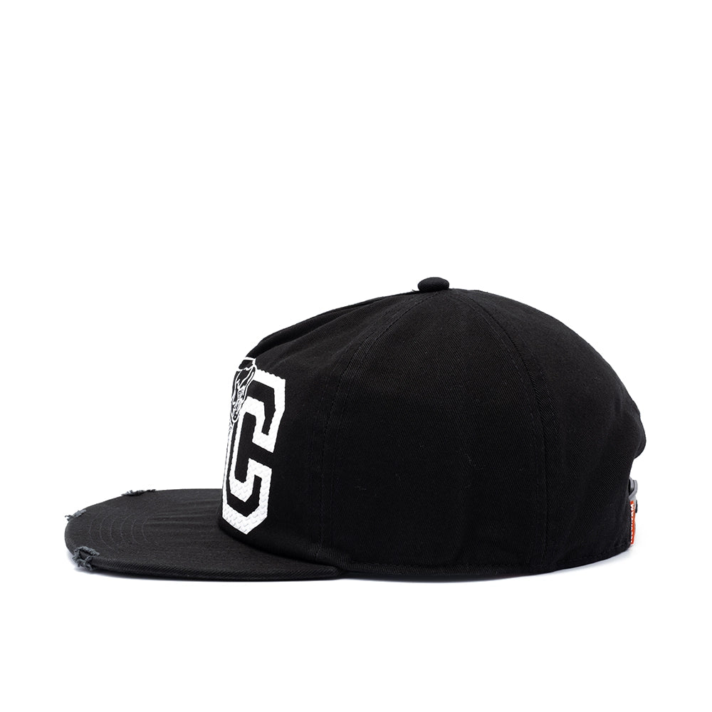 A black flat-brim baseball cap with a distressed finish, featuring a large white embroidered letter 'C' on the side with a black outline.