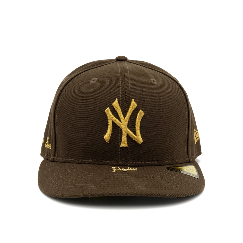 Front view of walnut brown New York Yankees 59FIFTY fitted cap with gold NY embroidery and Yankees visor pin.