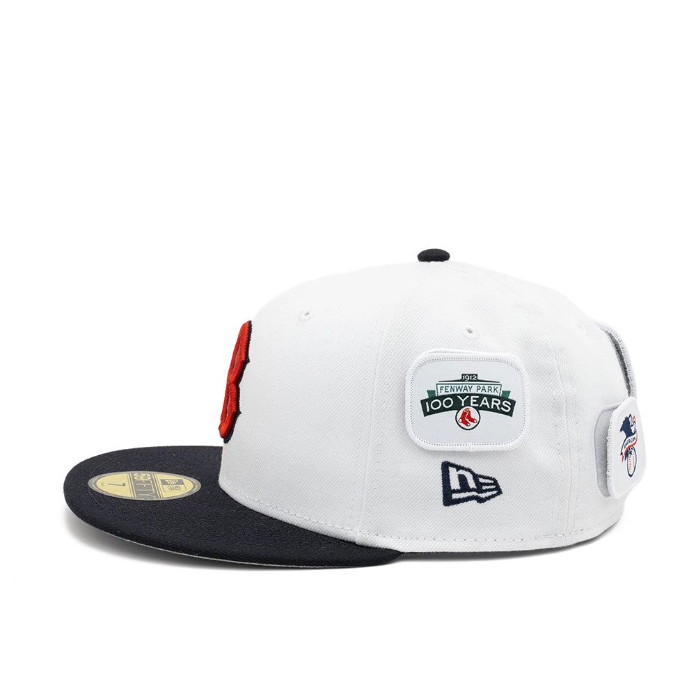 Side view of the white Boston Red Sox fitted cap with a Fenway Park 100 Years patch above the New Era flag.