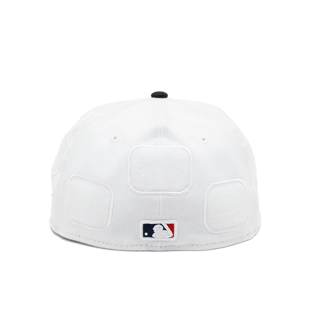 Rear view of the white Boston Red Sox fitted cap with three blank patch panels and an embroidered MLB logo.
