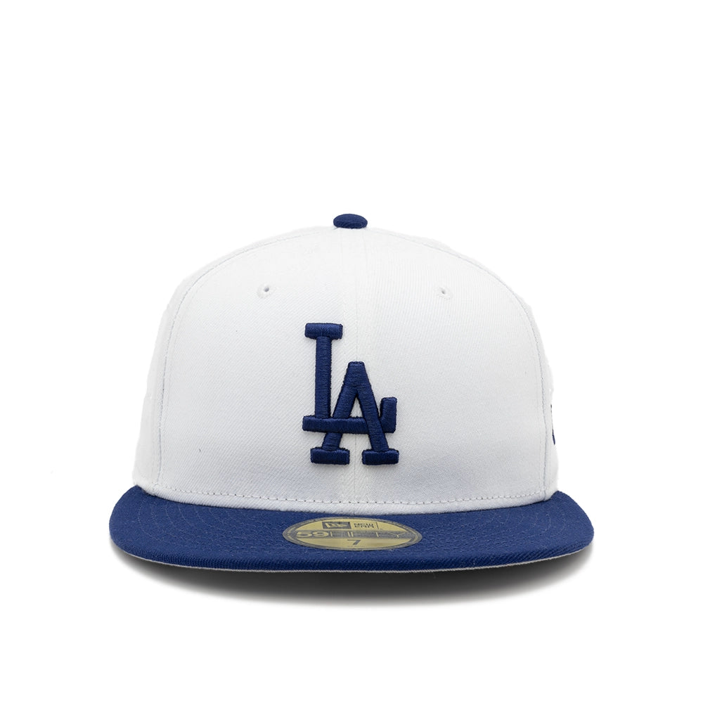 Front view of the white Los Angeles Dodgers 59FIFTY fitted cap with a navy LA logo and flat navy brim.