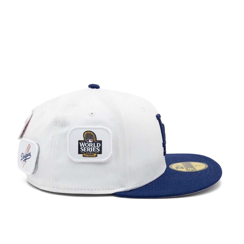 Side view of the white Dodgers fitted cap with a 2024 World Series patch and Dodgers script patch.