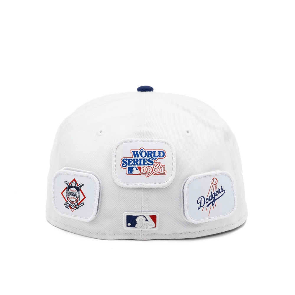 Back view of the white Dodgers cap with a 1981 World Series patch, Dodgers script patch, and MLB logo.