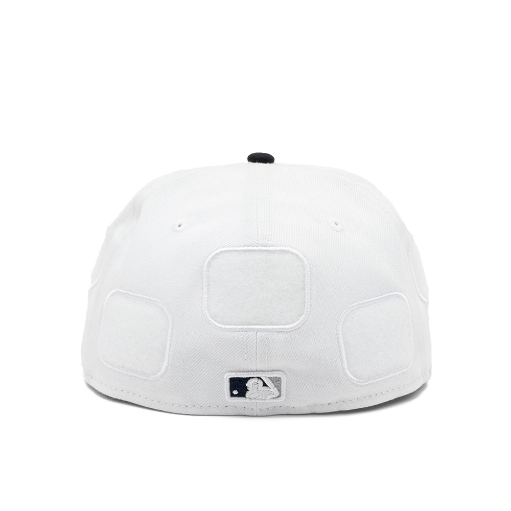 Rear view of the white Yankees 59FIFTY fitted cap with three empty patch panels and an embroidered MLB logo.