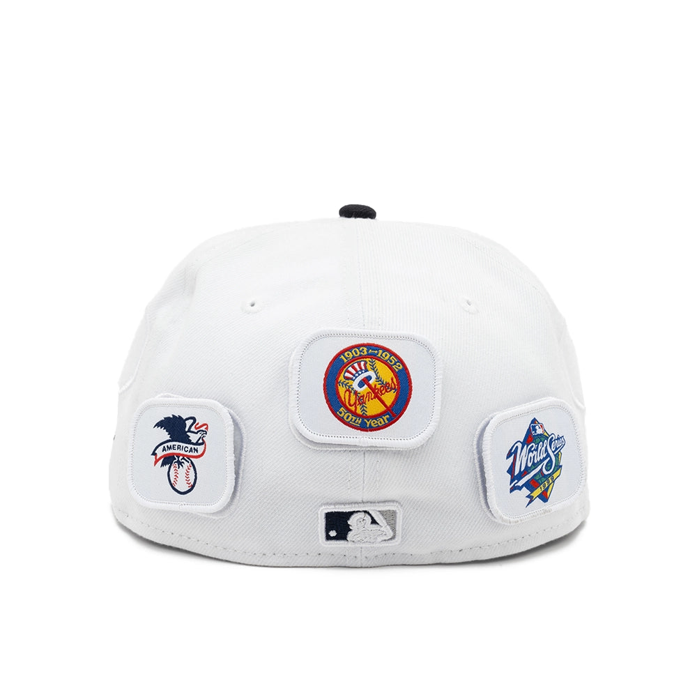 Rear view of the white Yankees fitted cap with 50th anniversary, American League and World Series patches.