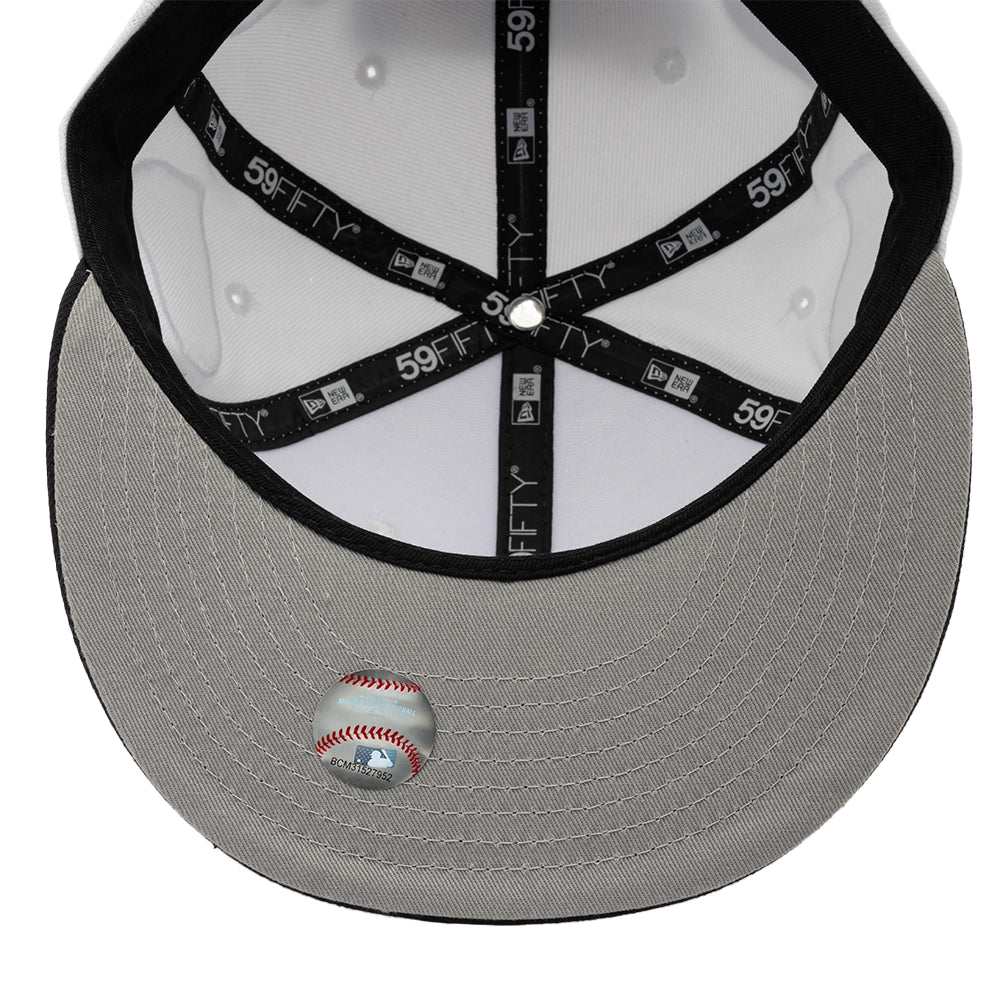Interior view of the Yankees 59FIFTY fitted cap showing a gray undervisor, black sweatband and branded seam taping.