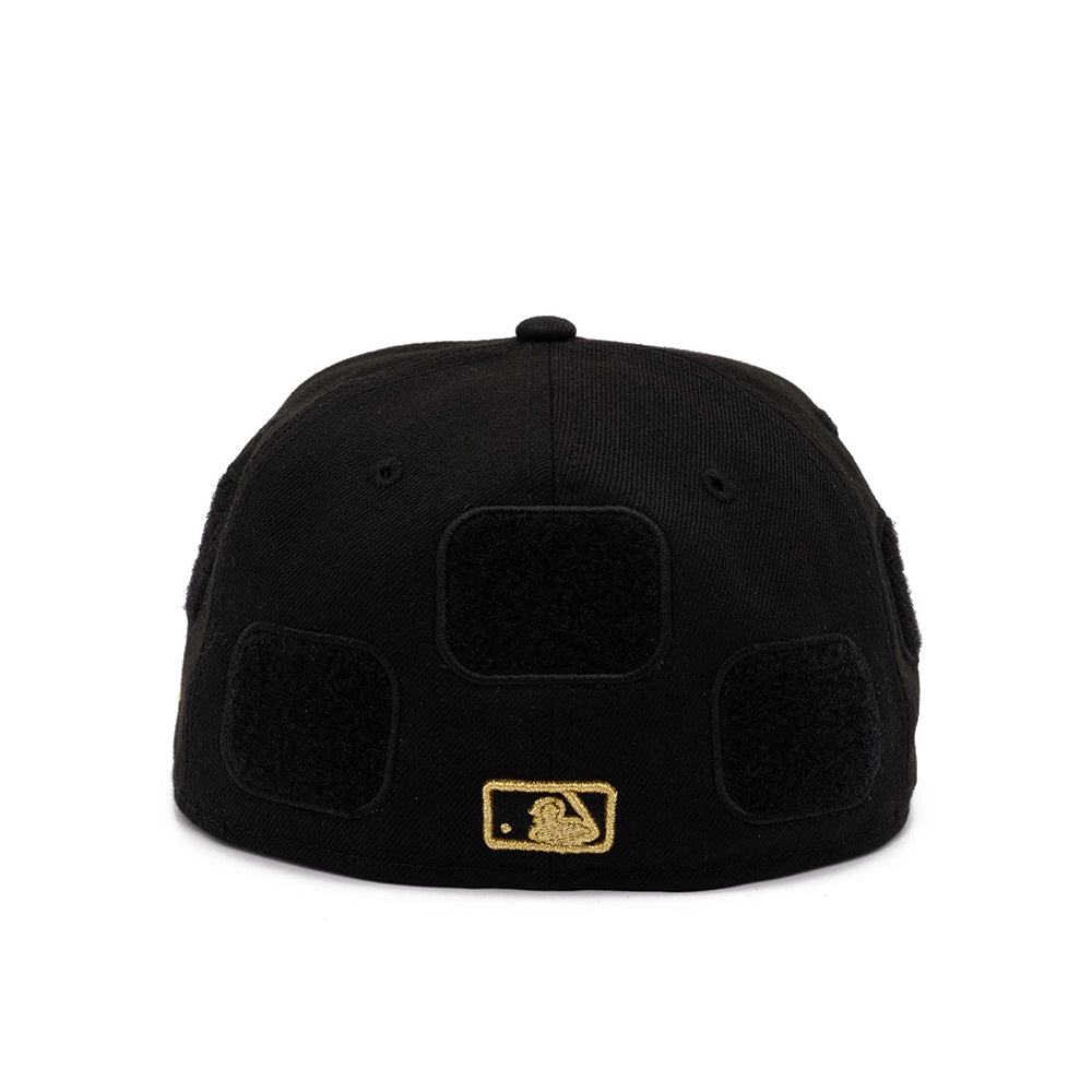 Back view of black Yankees 59FIFTY cap with blank velcro patches and gold MLB batter logo