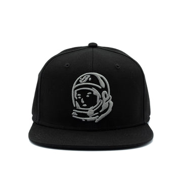 A black flat-brim snapback cap featuring an embroidered gray astronaut helmet logo on the front, set against a plain white background.