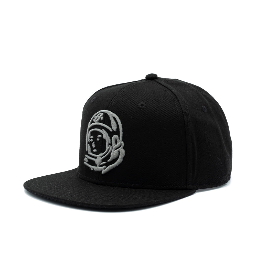 A black flat-brim snapback cap featuring an embroidered light gray astronaut helmet logo on the front, set against a plain white background.