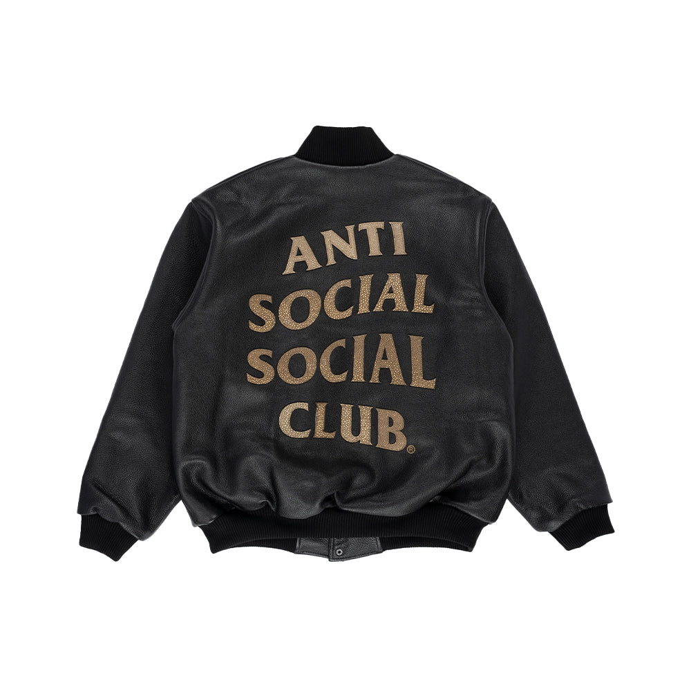 Back view of black Anti Social Social Club leather bomber jacket with oversized tan snakeskin appliqué lettering.