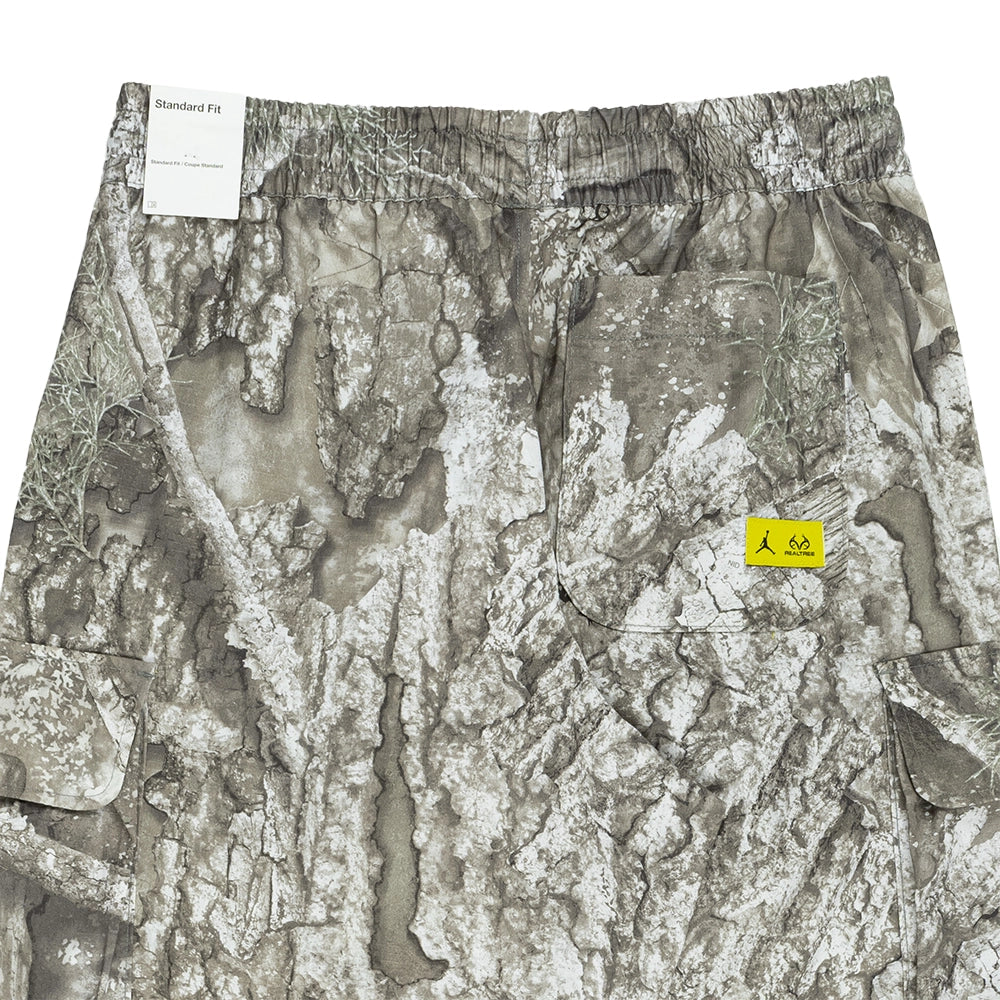 Back waistband and pocket detail on Jordan Brooklyn Realtree pants with a bright citron logo patch.