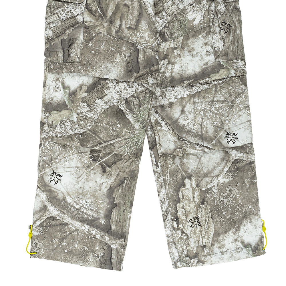 Front leg detail of Jordan Brooklyn Realtree cargo pants with camouflage print and bright citron hem drawcords.
