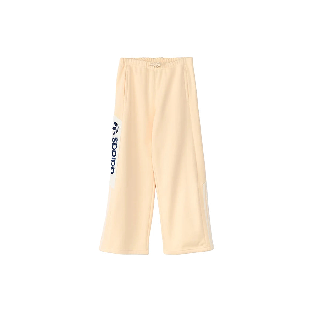 adidas adiSignature NY Warm Vanilla sweatpants, front view with wide legs and navy adidas logo.