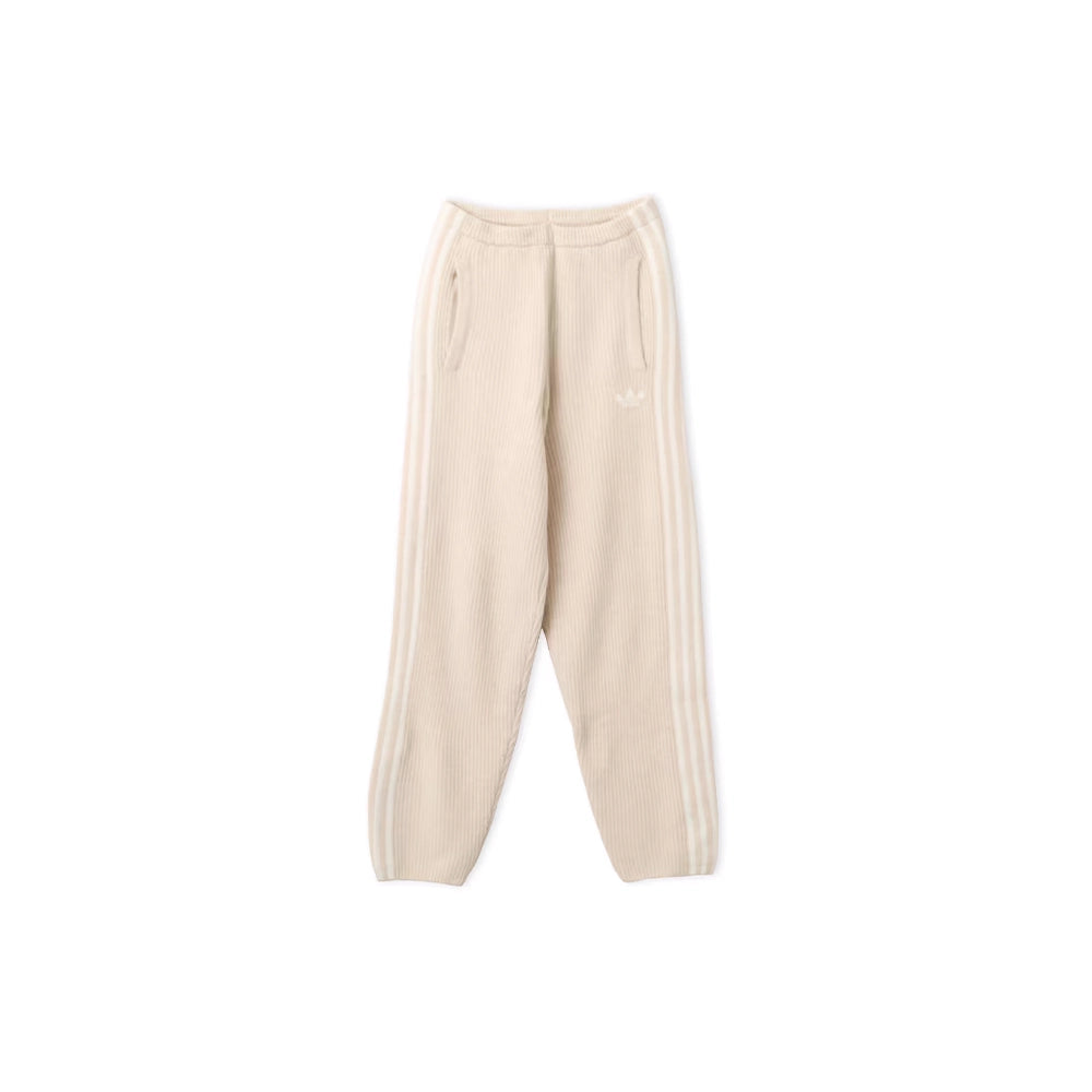 Front view of adidas x Jennie Bliss cream knit pants with balloon legs, side pockets and tonal 3-Stripes.