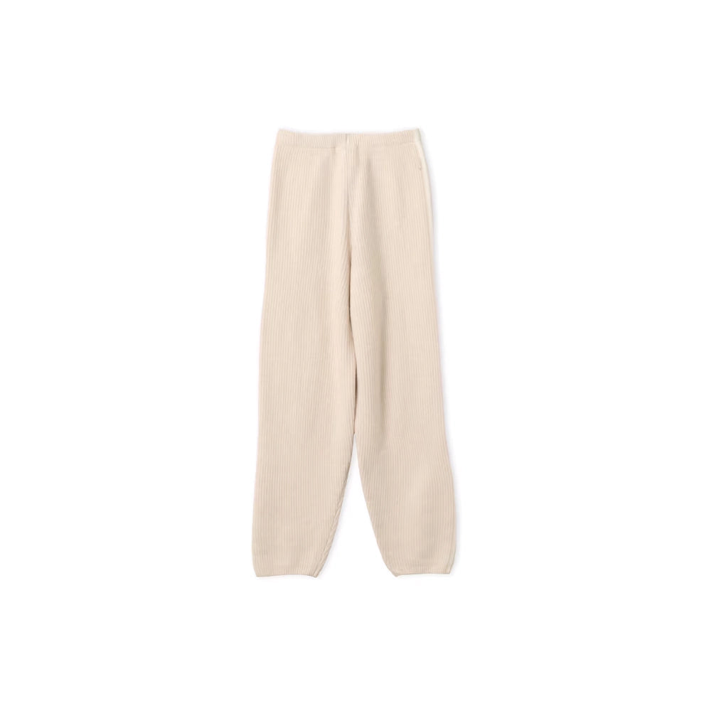 Back view of adidas x Jennie Bliss cream knit pants with a loose balloon-leg silhouette.
