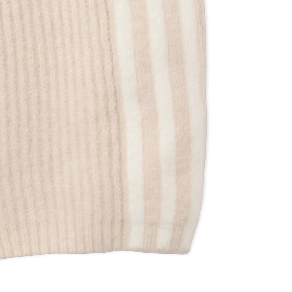 Close-up of the ribbed hem and tonal 3-Stripes on adidas x Jennie Bliss cream knit pants.