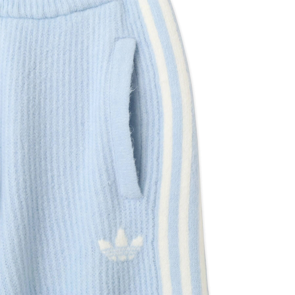 Close-up of the side pocket, white Trefoil logo and 3-Stripes on adidas x Jennie Wonder Blue knit pants.