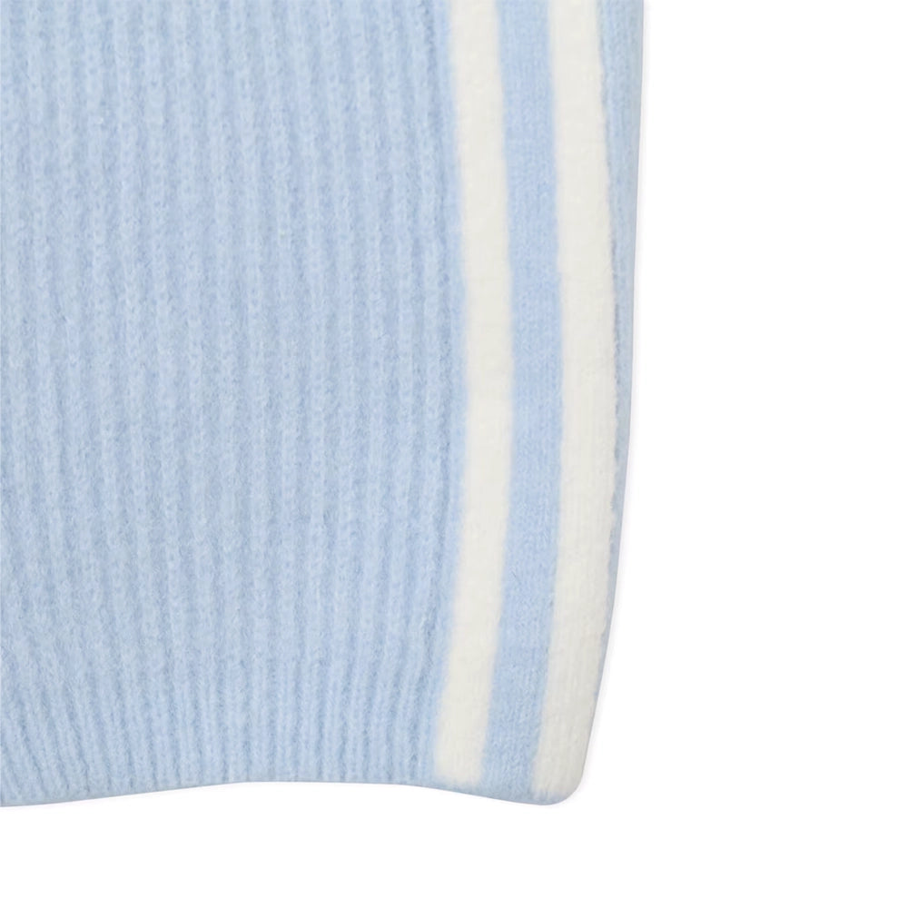 Close-up of the ribbed hem and white side stripes on adidas x Jennie Wonder Blue knit pants.