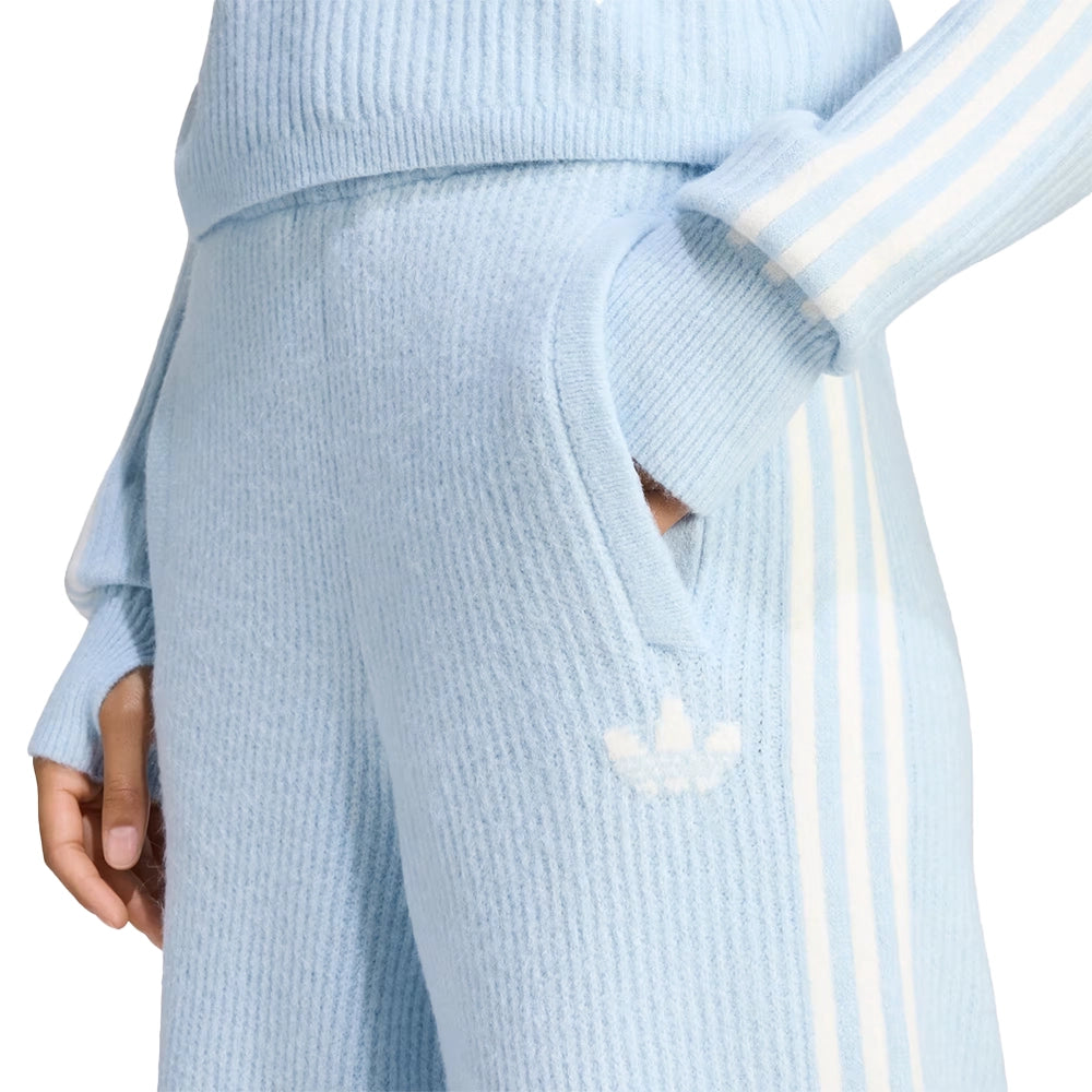 Model wearing adidas x Jennie Wonder Blue knit pants, showing the side pocket, Trefoil logo and white stripes.
