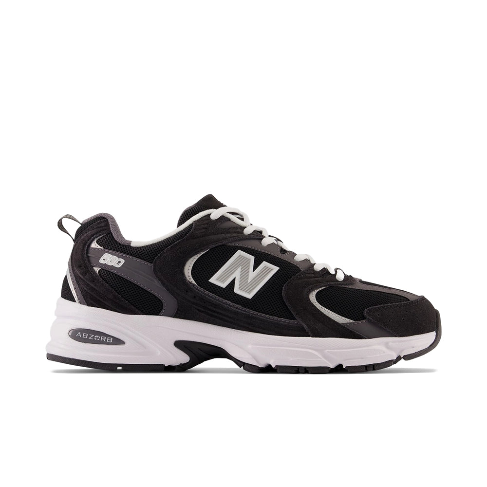 New Balance 530 Black Magnet Silver Metallic, side view with silver N logo and white ABZORB midsole.