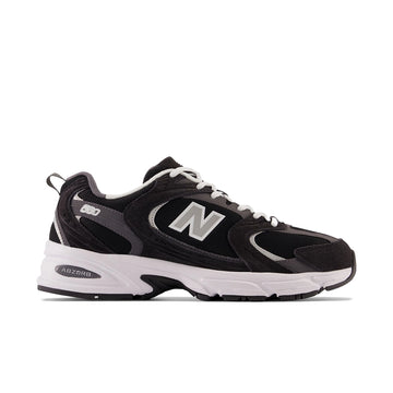 New Balance 530 Black Magnet Silver Metallic, side view with silver N logo and white ABZORB midsole.