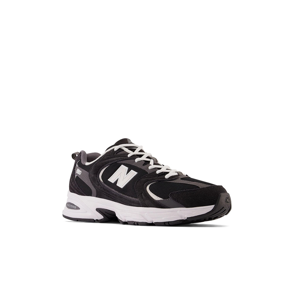 New Balance 530 Black Magnet Silver Metallic, front three-quarter view with black mesh and white laces.