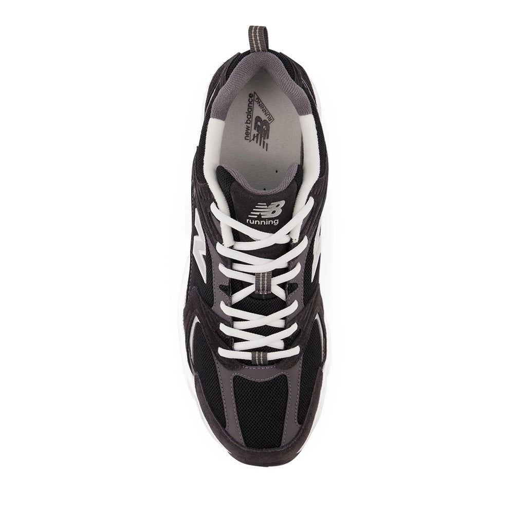 New Balance 530 Black Magnet Silver Metallic, top view showing white laces, black mesh toe and gray lining.