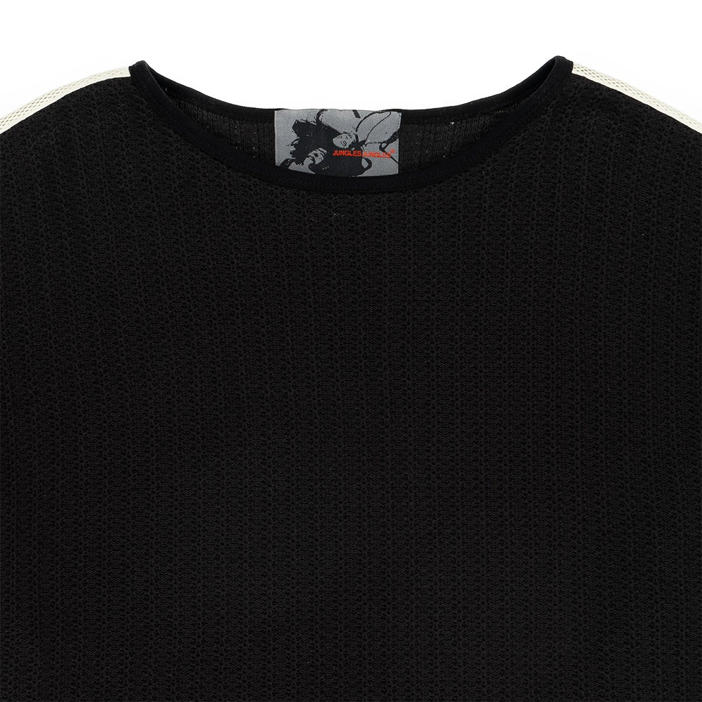 Close-up of a black textured knit crewneck sweater with white shoulder stripes and a gray neck label.