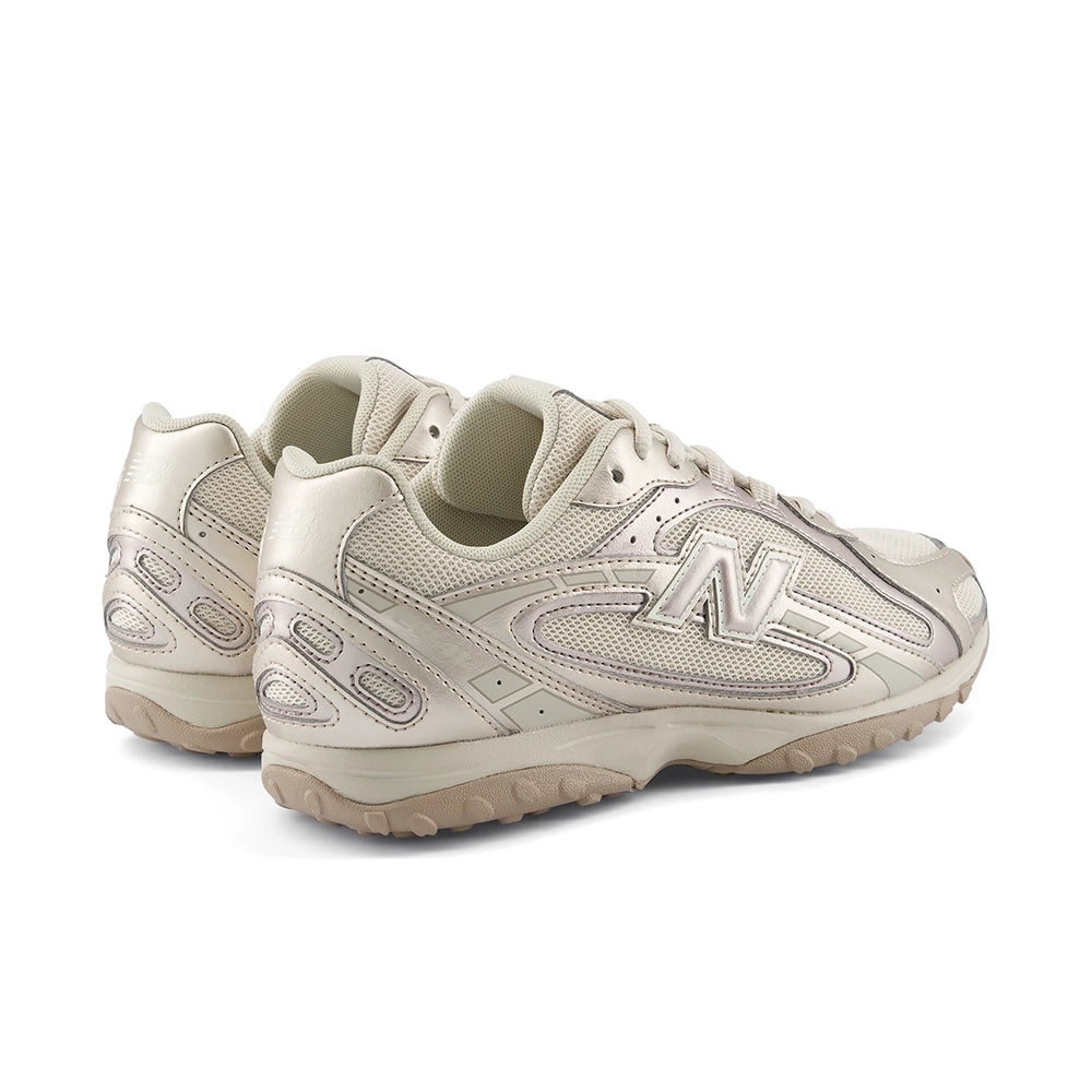 Pair of New Balance 204L Timberwolf Light Gold Metallic sneakers, rear three-quarter view.