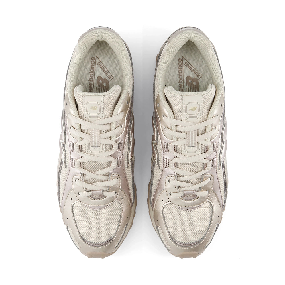 New Balance 204L Timberwolf Light Gold Metallic sneakers, top view showing cream laces and mesh toe boxes.