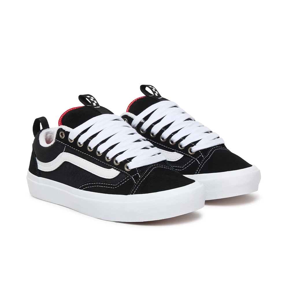 A pair of black and white Vans Old Skool sneakers with white laces, a white side stripe, and a small red accent on the tongue lining, shown on a white background.